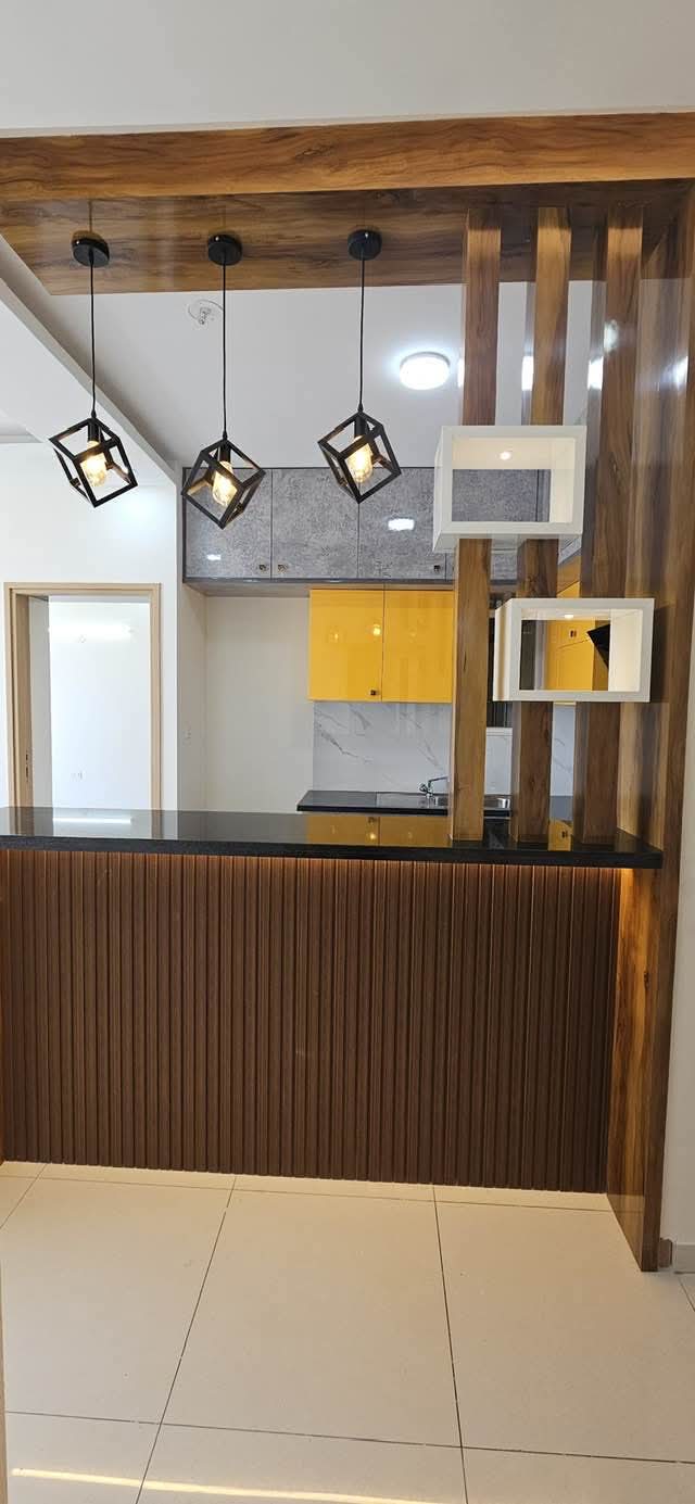 Breakfast Counter with Wooden Fluting — Kitchen project in Bengaluru by Classy Creations